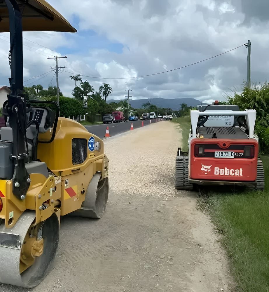A Bobcat Truck Is Parked On The Side Of The Road — Wilsons Excavations & Plant Hire in Myocum, NSW