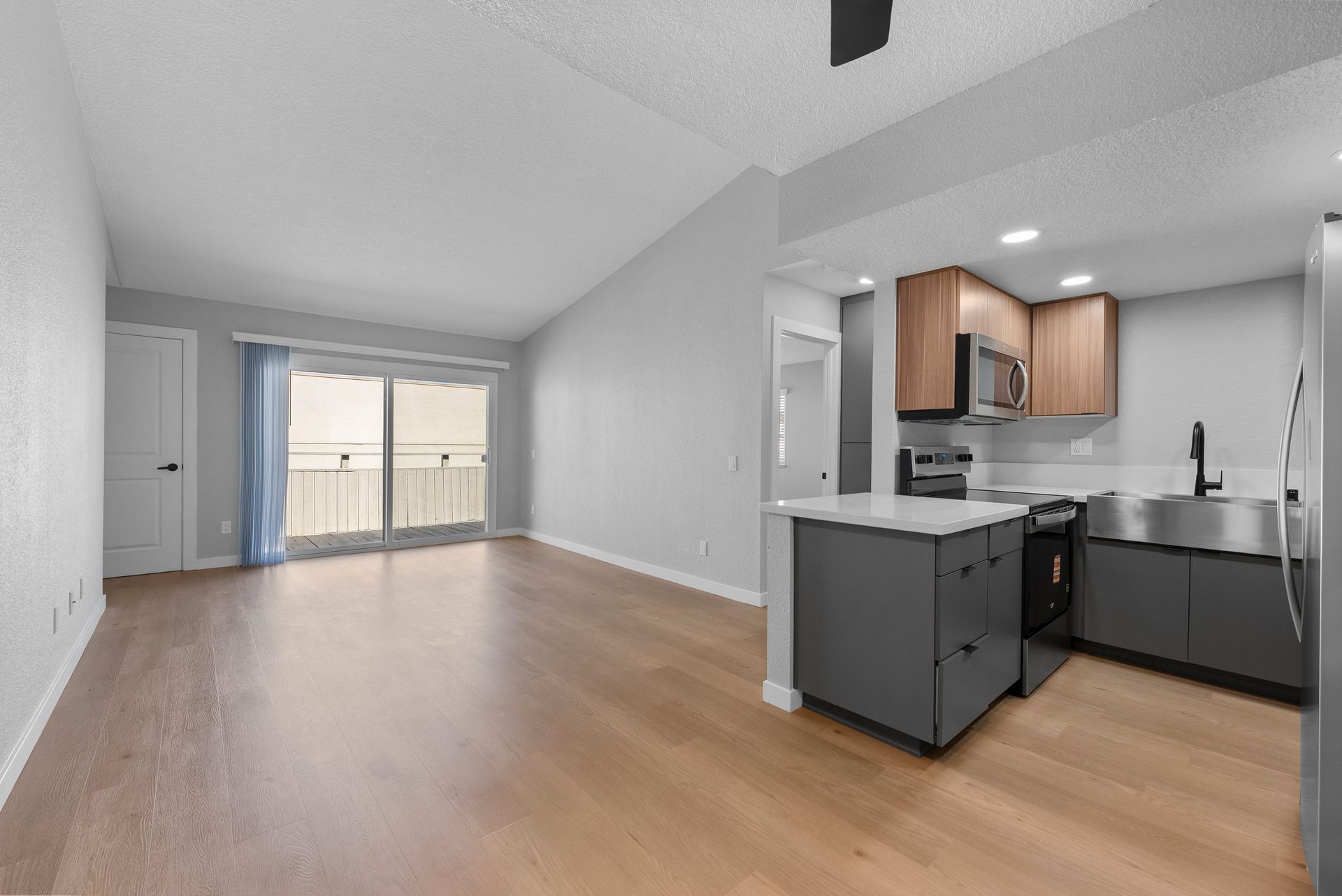 Unfurnished apartment living room and kitchen