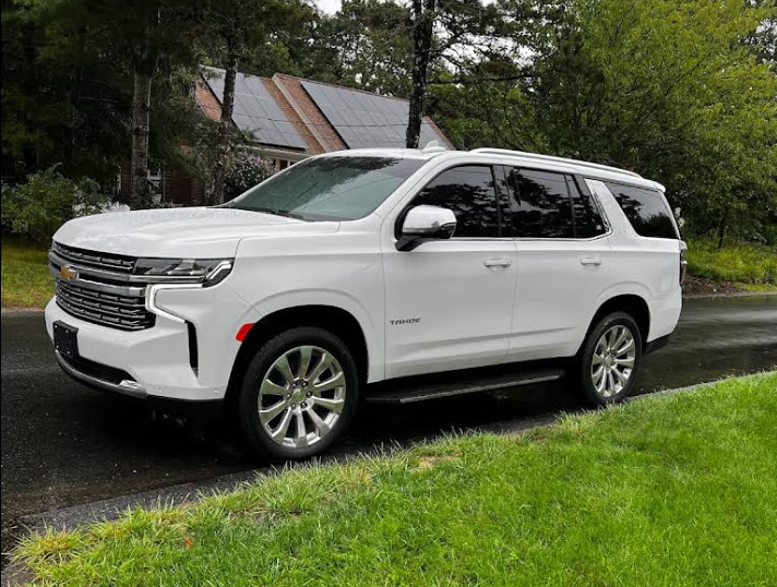 A white chevrolet tahoe suv is shown on a white background.