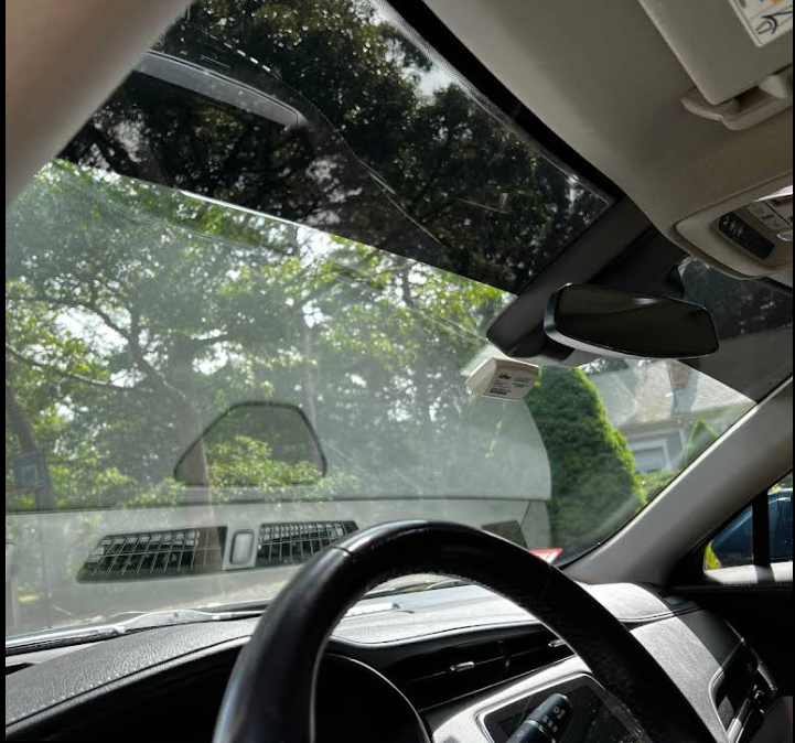 A car with a sticker on the windshield that says ' airbag '