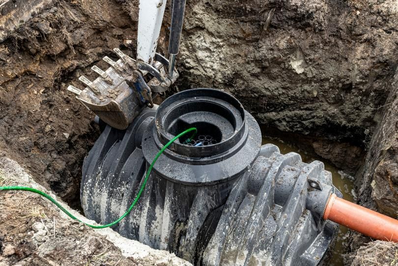A Septic Tank is Being Installed in a Hole in the Ground  — Matt's Mini Machines in Bli Bli, QLD