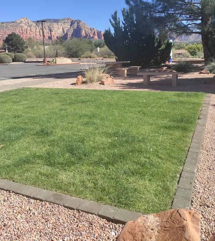 grass and paver landscaping with Arizona mountains in background