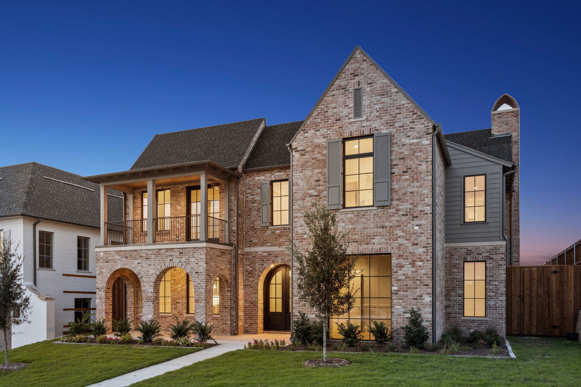 A living room with a couch , two coffee tables and a flat screen tv.
