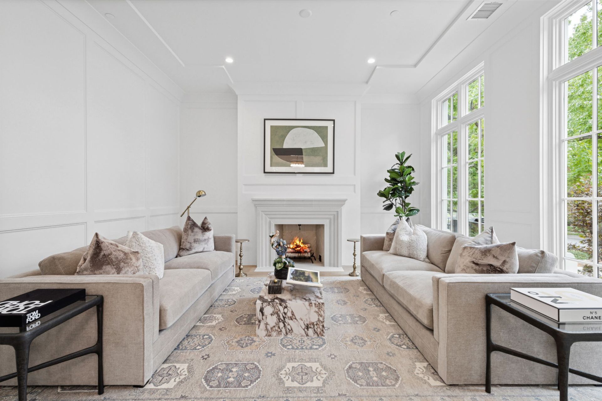 A living room with two couches and a fireplace