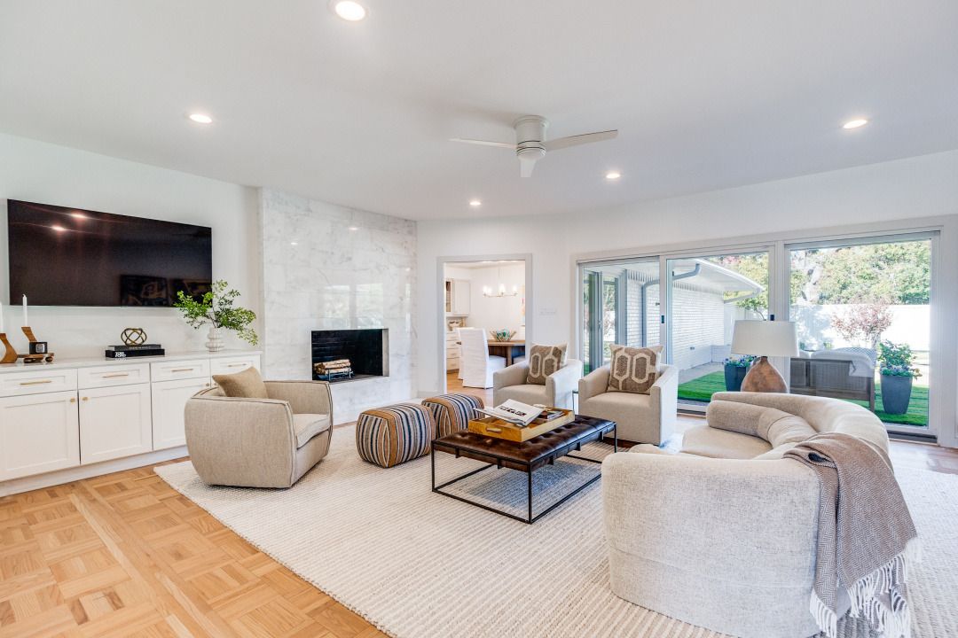A living room filled with furniture and a flat screen tv.