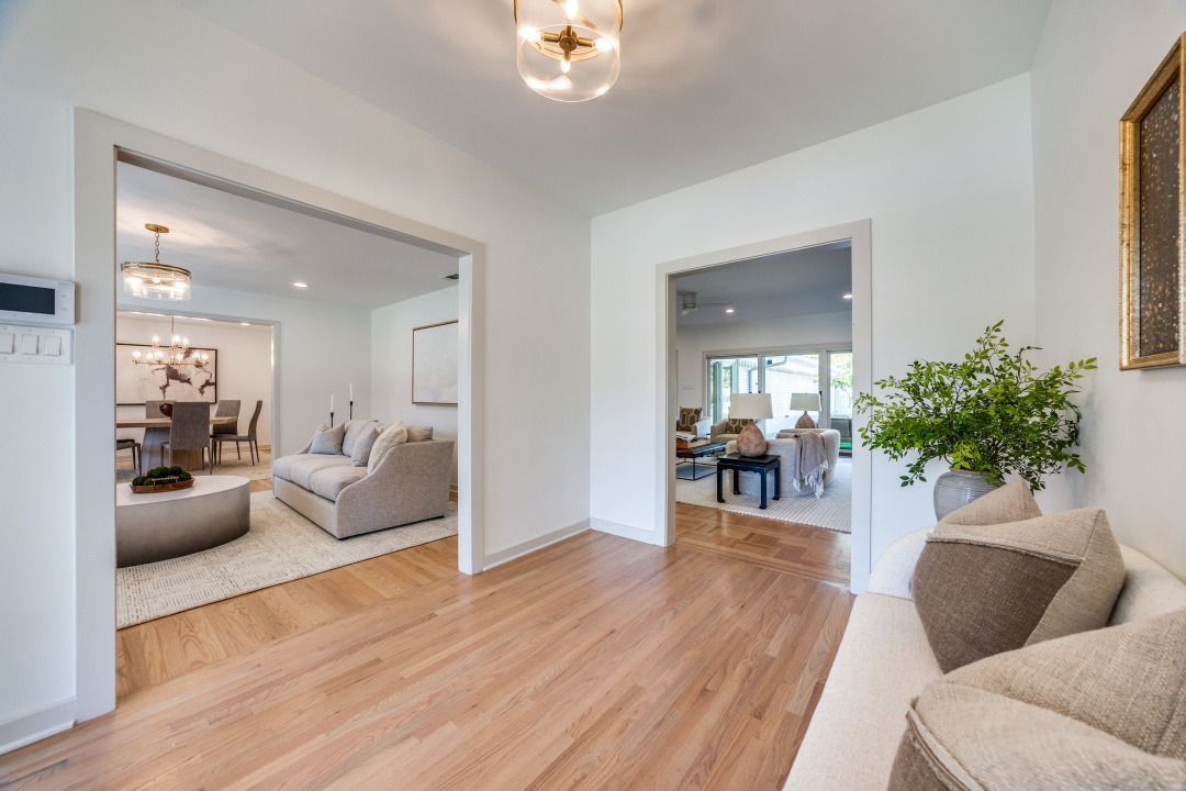 A living room with hardwood floors and a couch.
