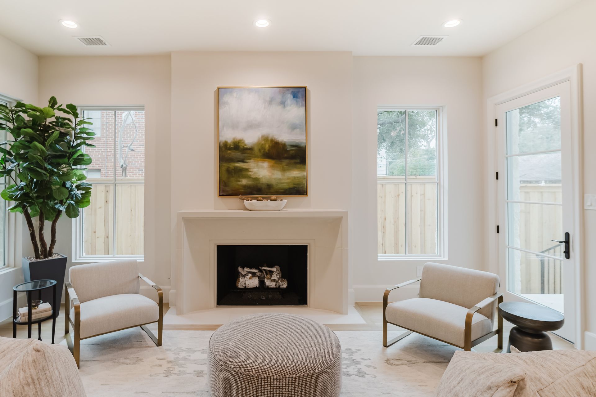 There is a fireplace in the middle of the living room.