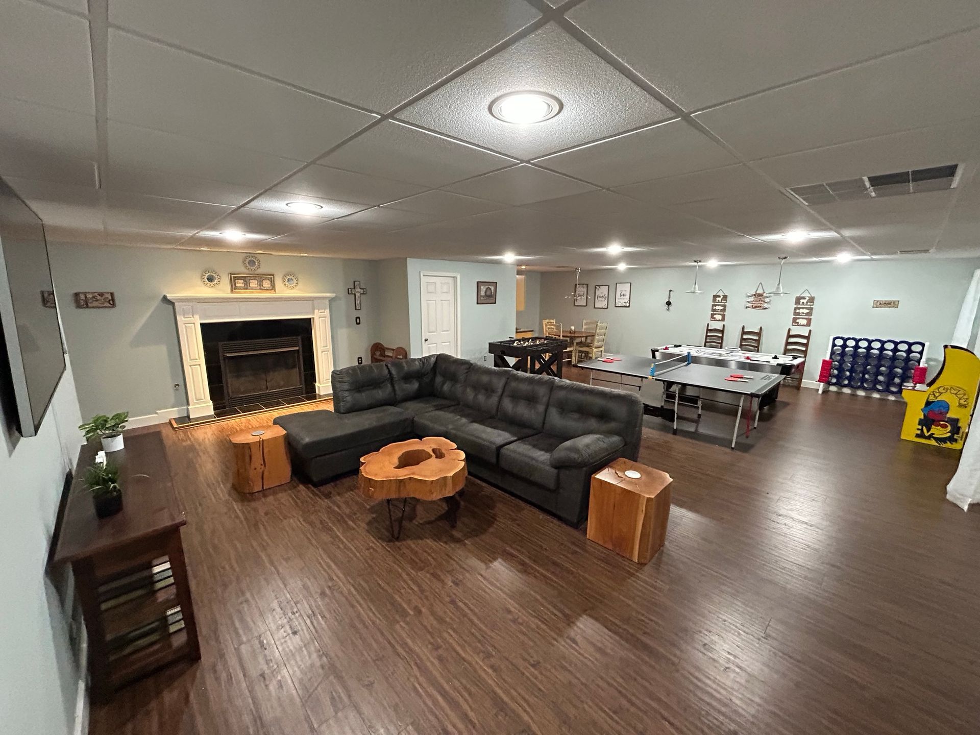 A living room filled with furniture and a fireplace.