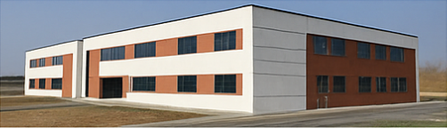 Edificio moderno con facciata bianca e marrone che si staglia contro il cielo azzurro.