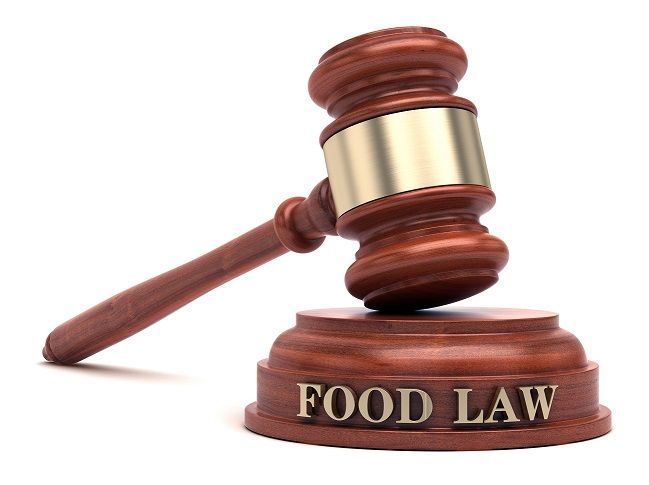 A wooden gavel with the word food law on it