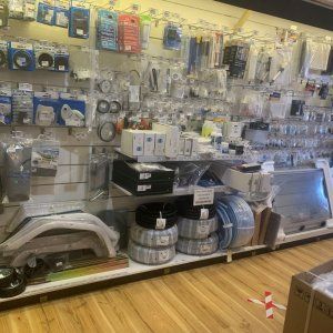 A display case filled with lots of items in a store.