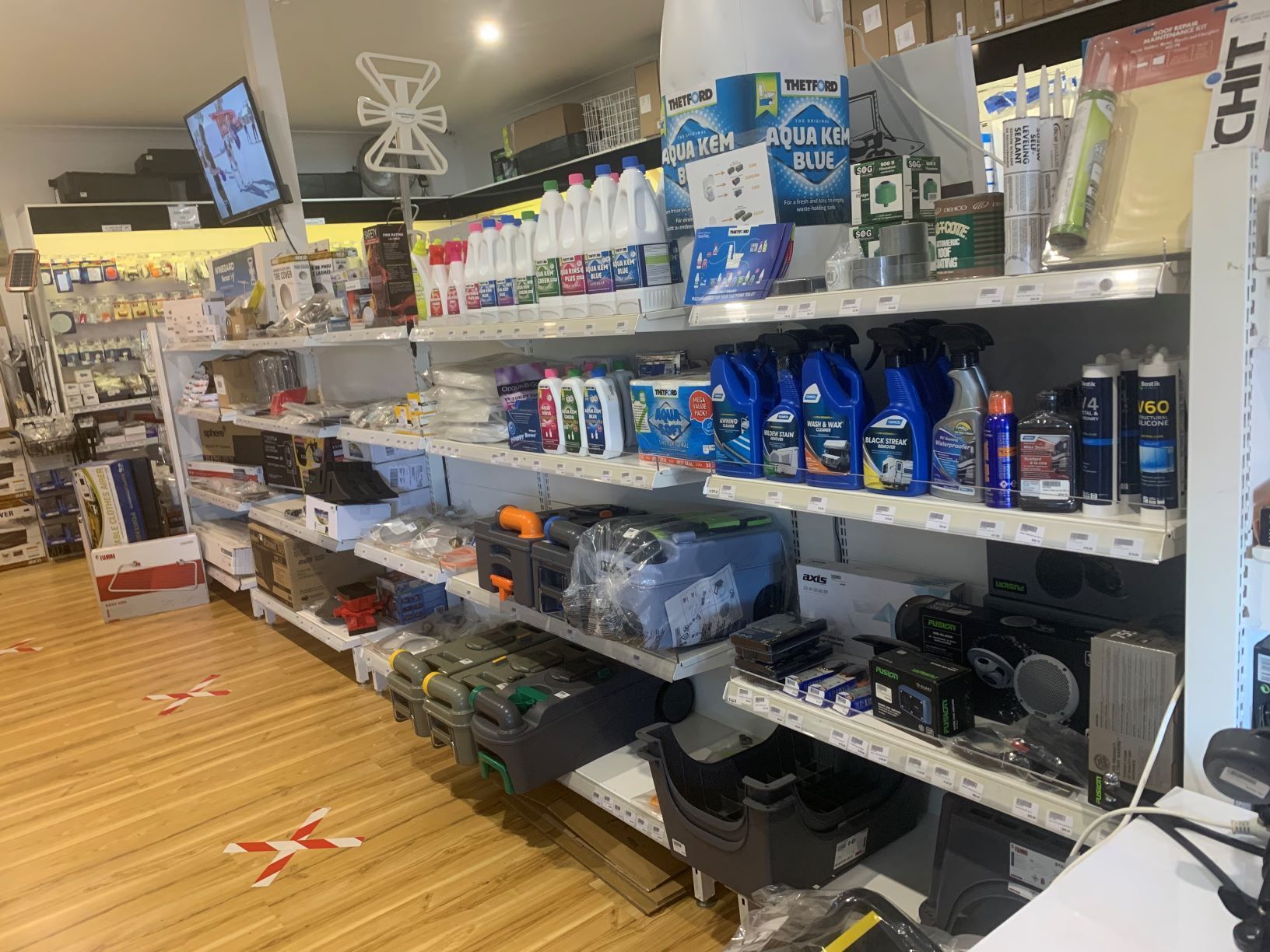 A store filled with shelves filled with lots of cleaning supplies.