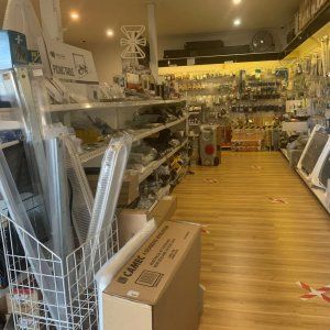 A store filled with lots of shelves and boxes on the floor.