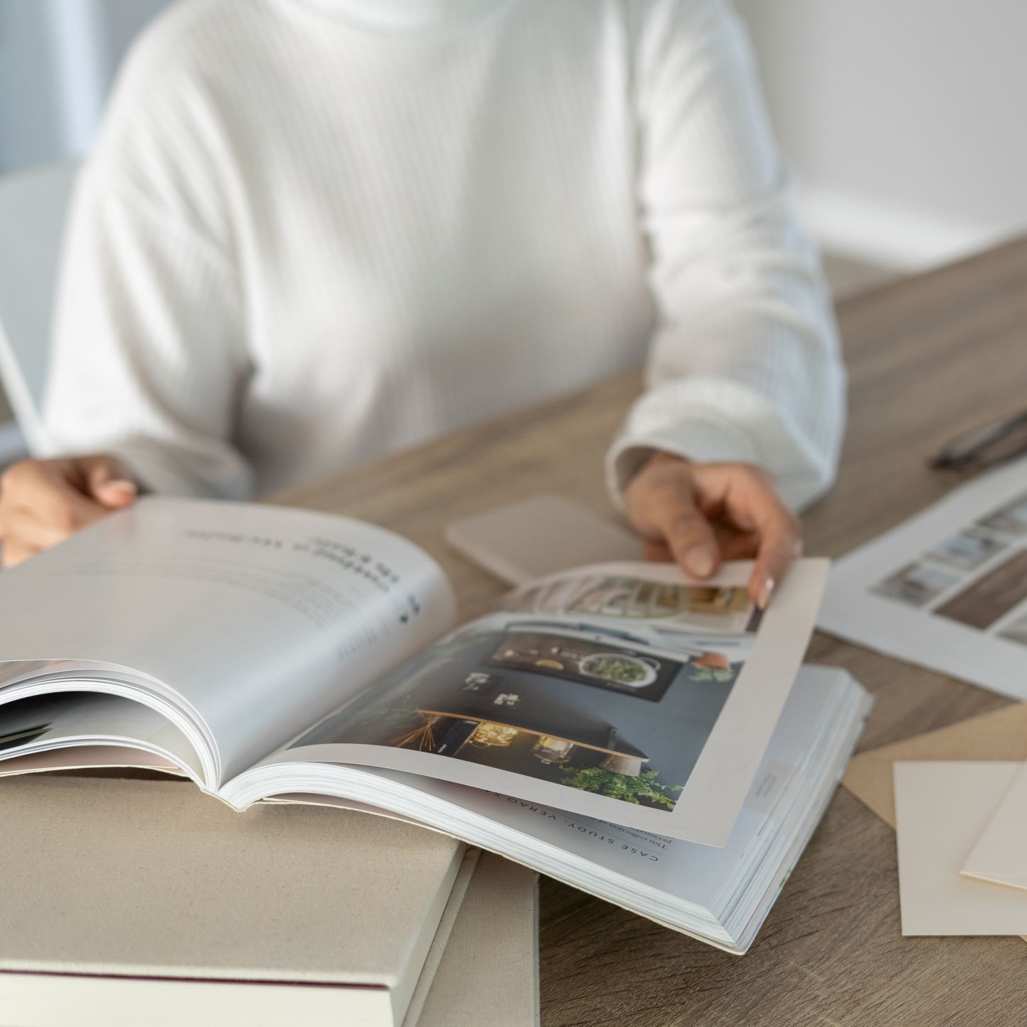 A virtual assistant reviewing print collateral branding for marketing plan.