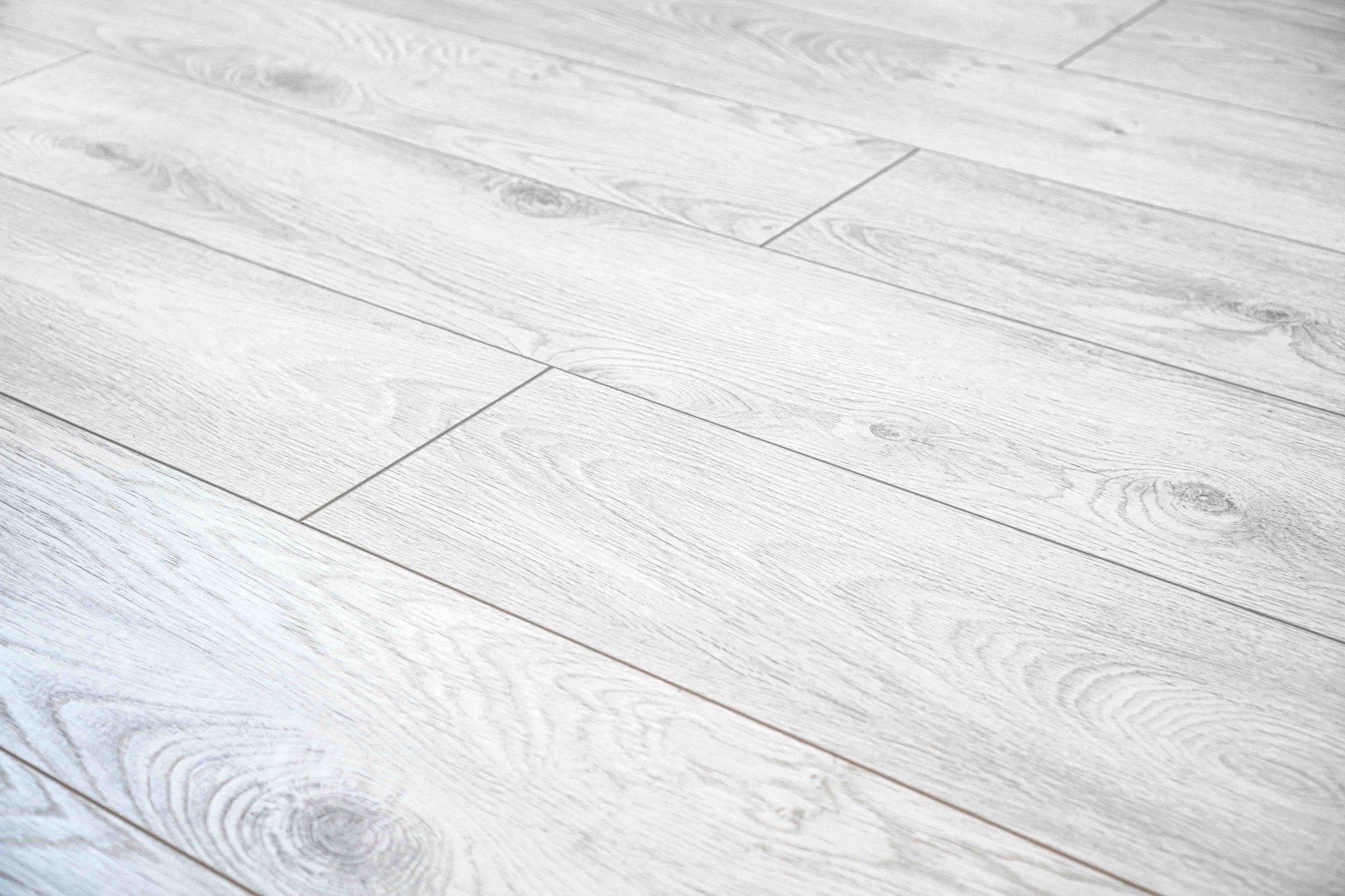 A close up of a white wooden floor.