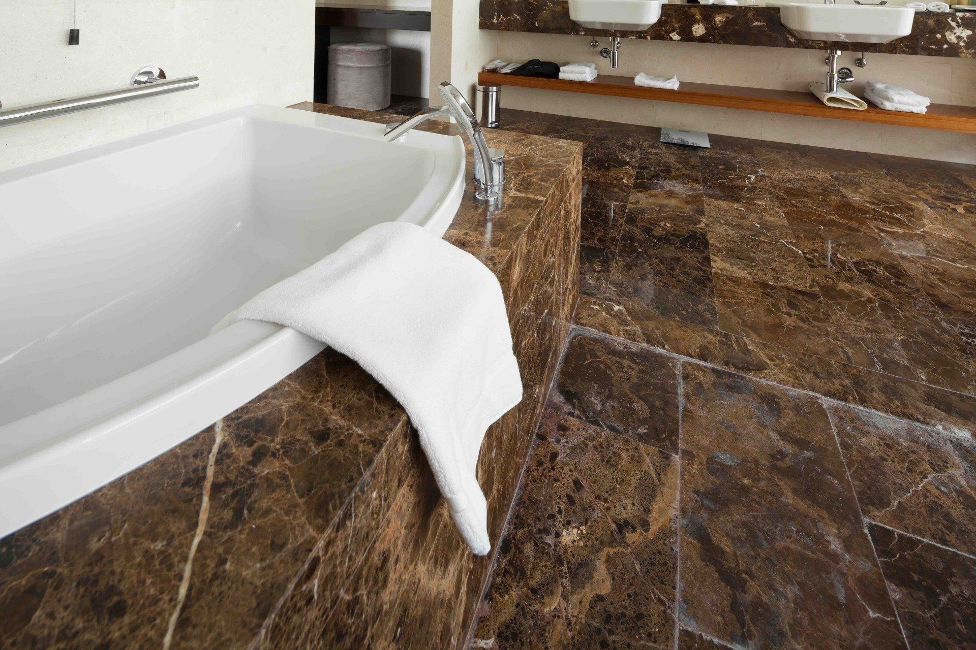 A bathroom with a bathtub and two sinks