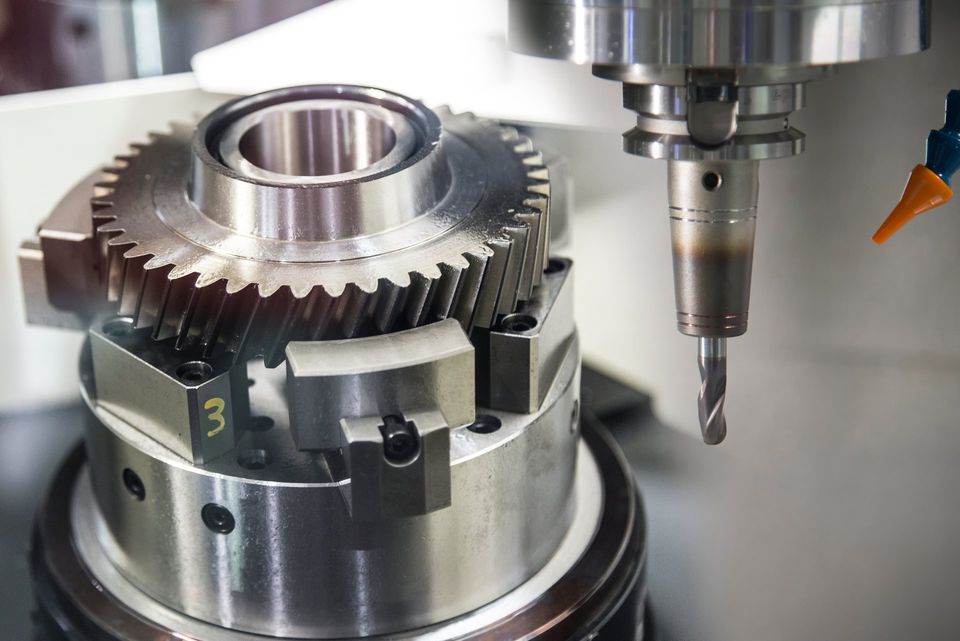 The mechanical part manufacturing process by CNC milling machine.