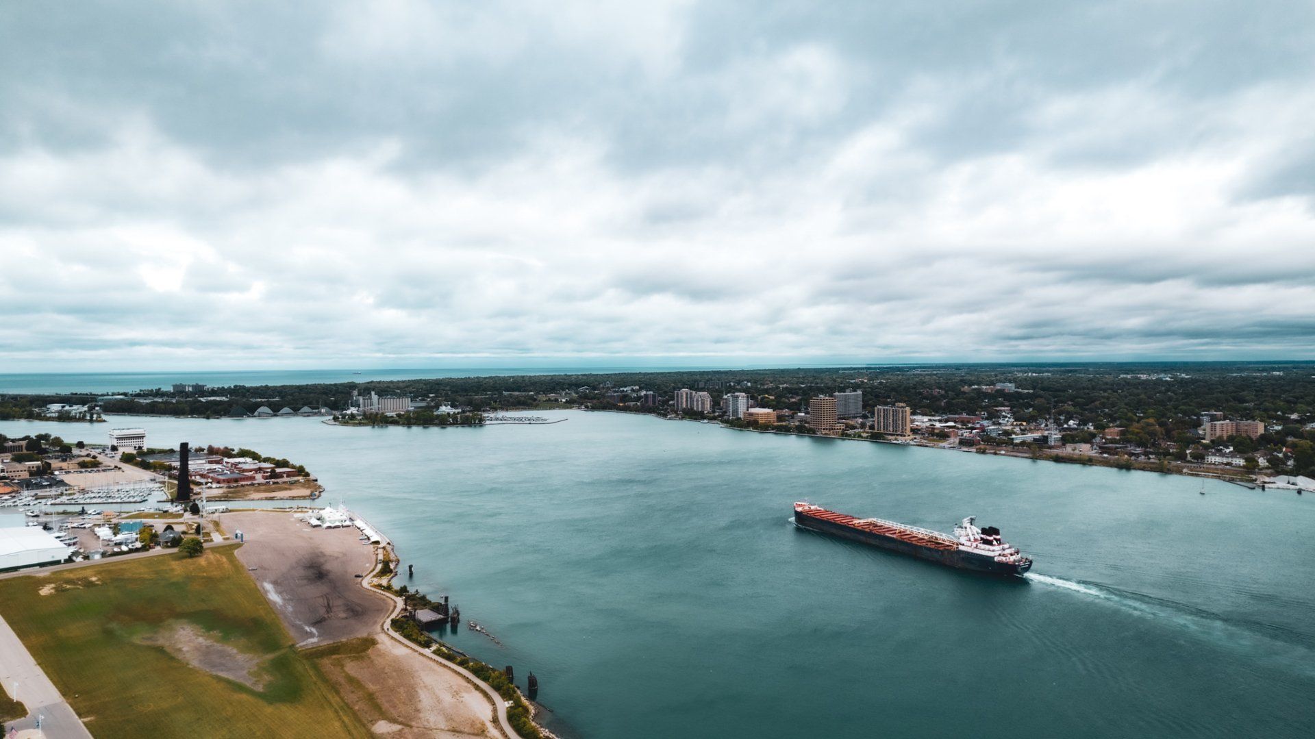 An aerial view of a large ship floating on top of a large body of water.