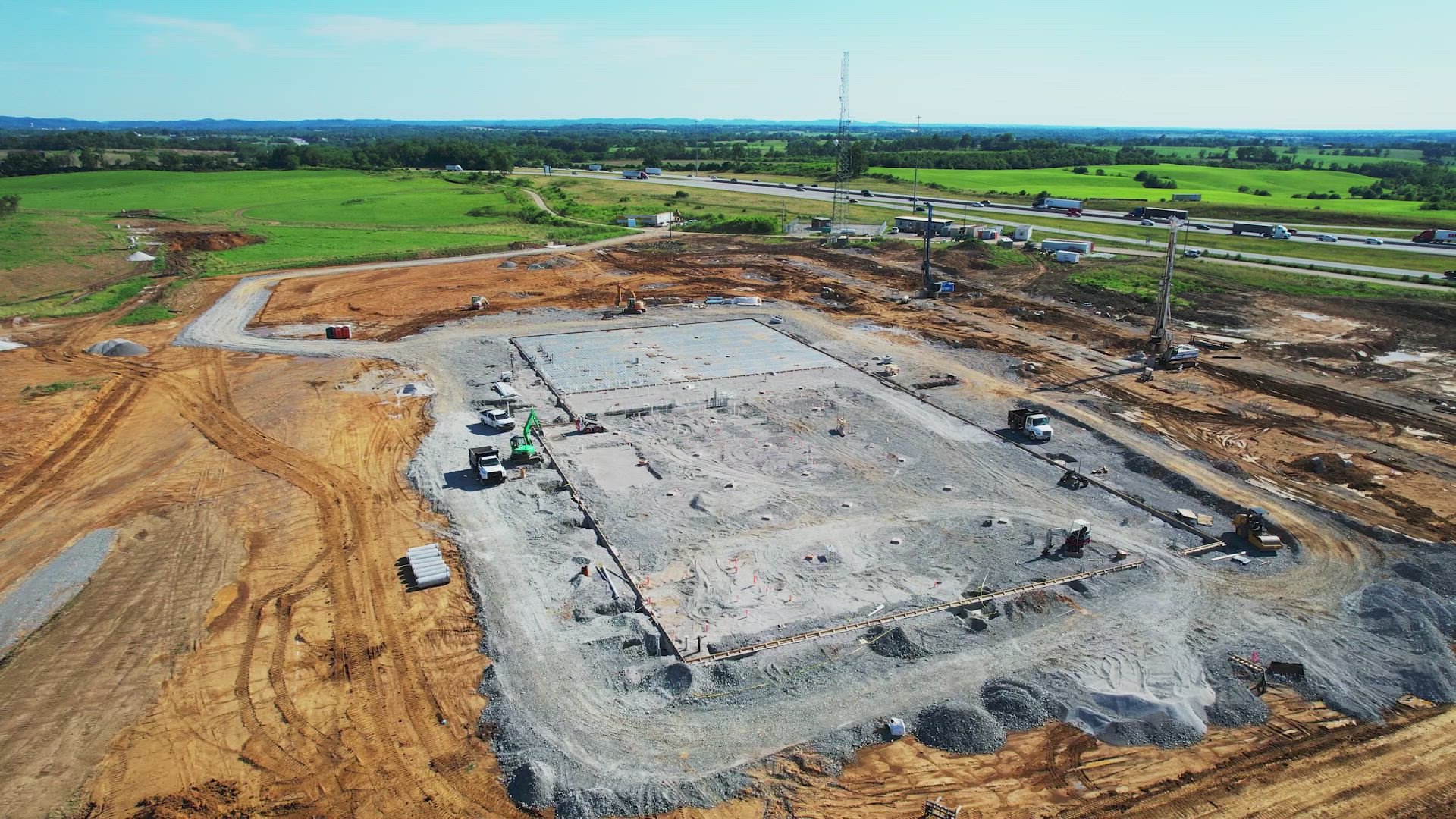 An aerial view of a construction site with a lot of dirt.