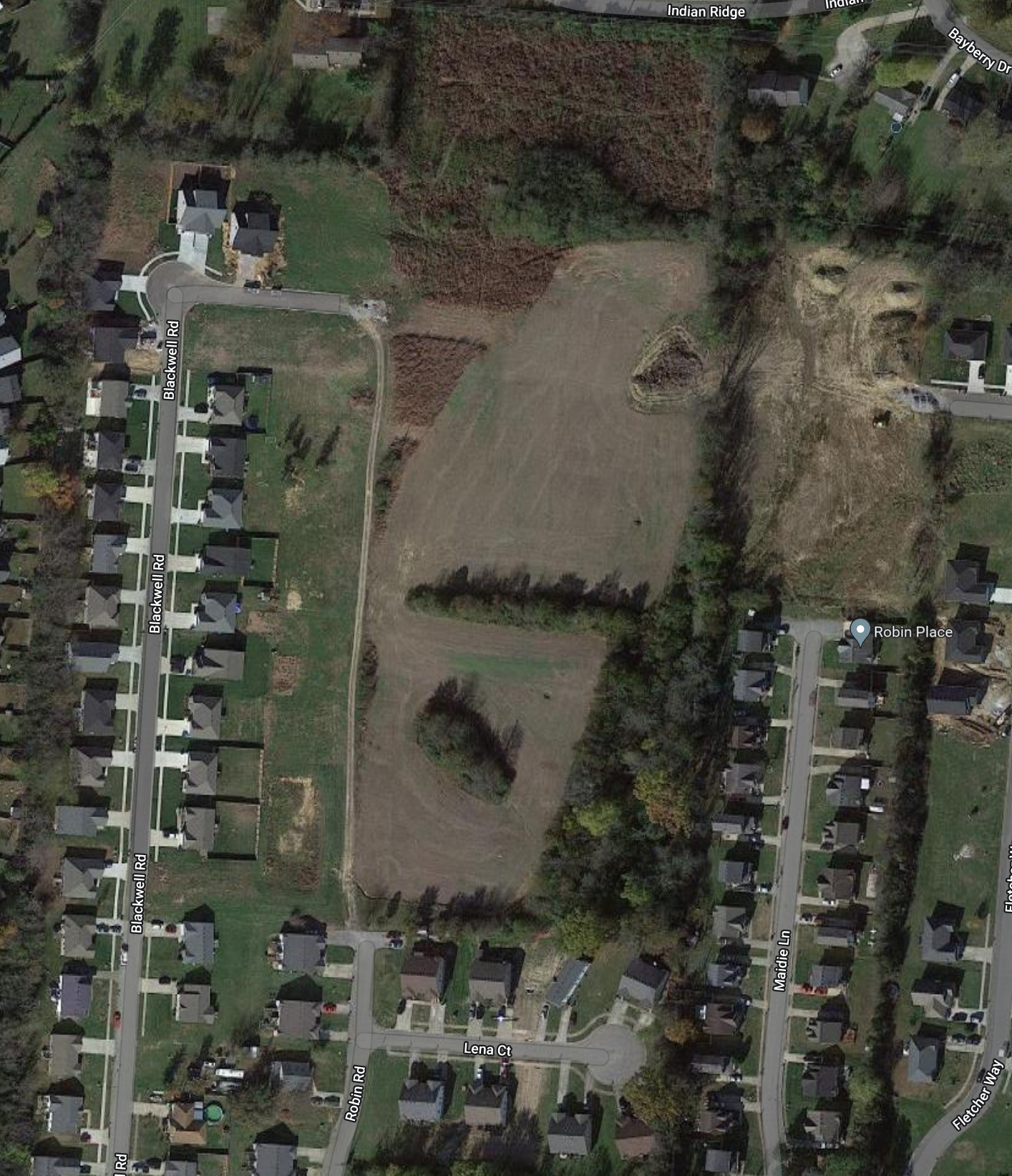 An aerial view of a residential area with lots of houses