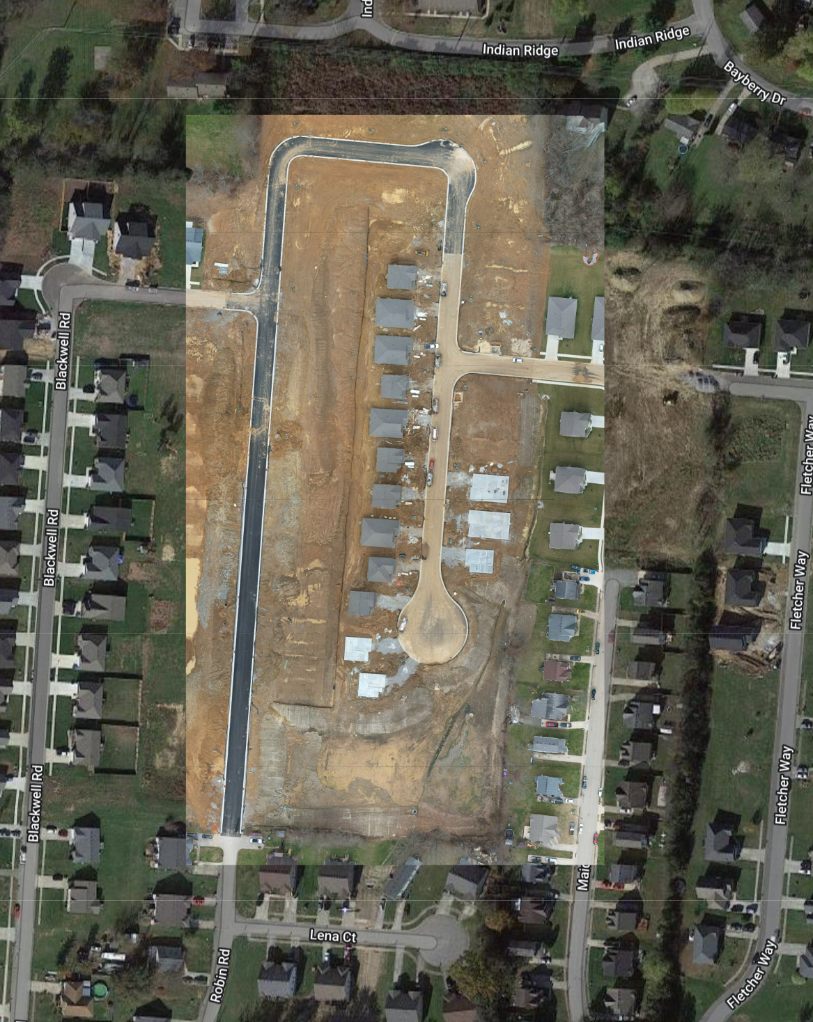 An aerial view of a residential area with lots of houses