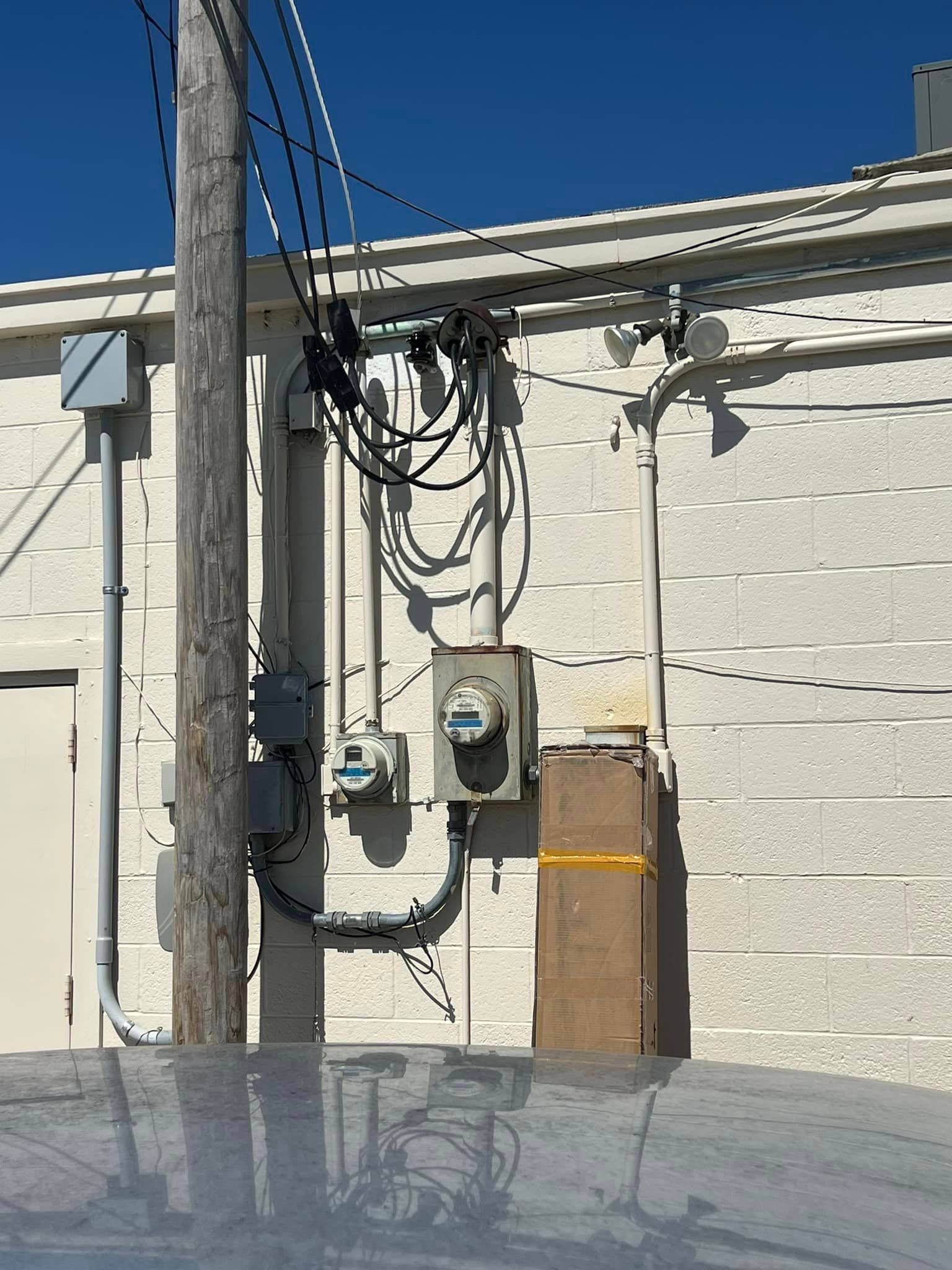 A building with a lot of wires coming out of it