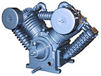 A large air compressor is sitting on top of a large tank. A large air compressor is sitting on top of a large tank.