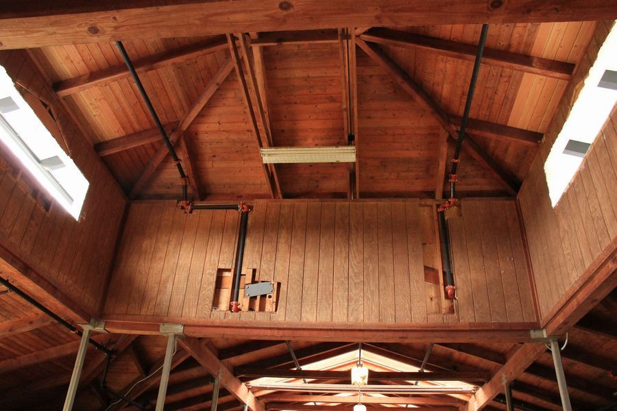 Looking up at the ceiling of a wooden building