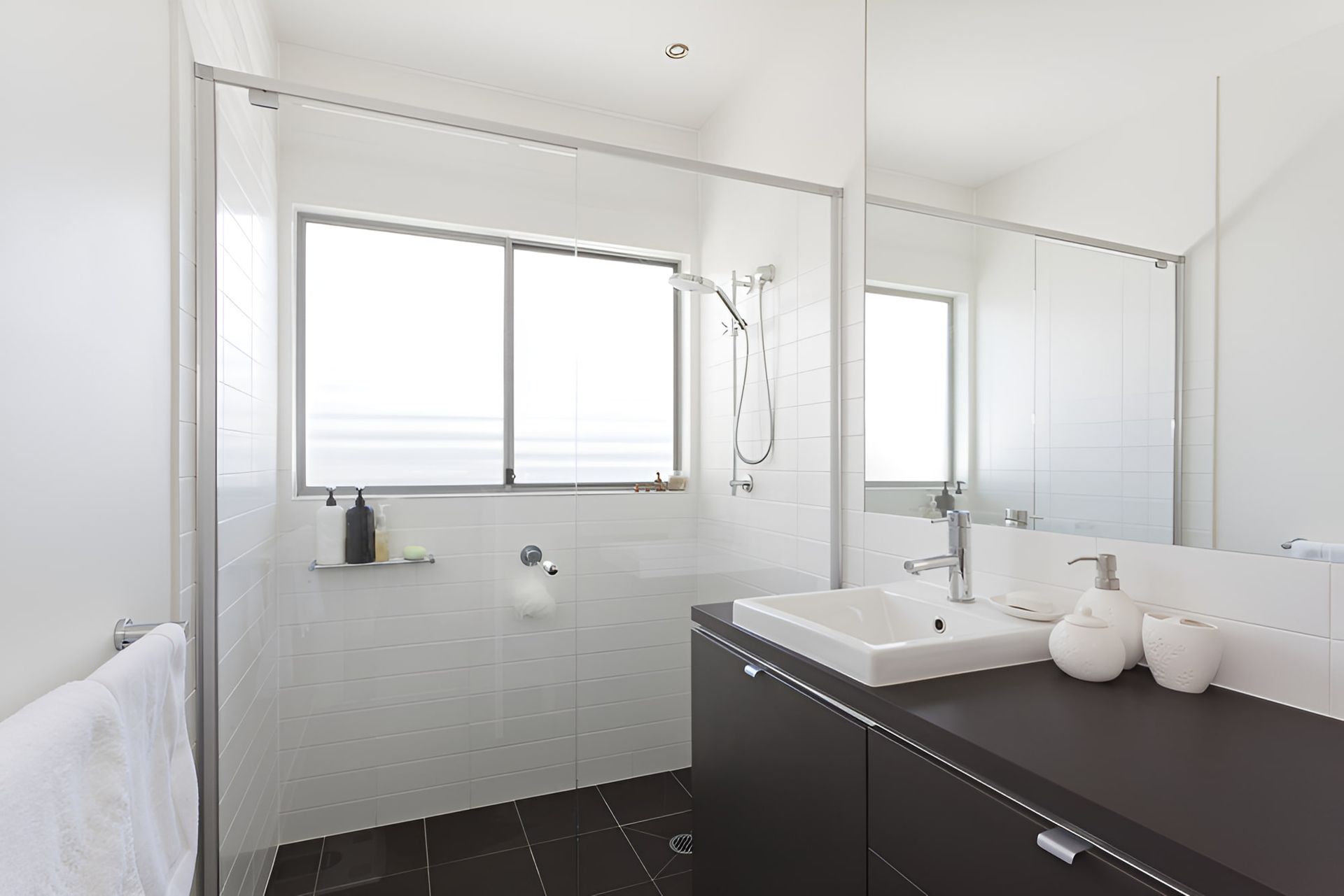 A Bathroom With A Sink , Mirror And Shower — McGrath Builders & Associates In Yarrawonga, VIC