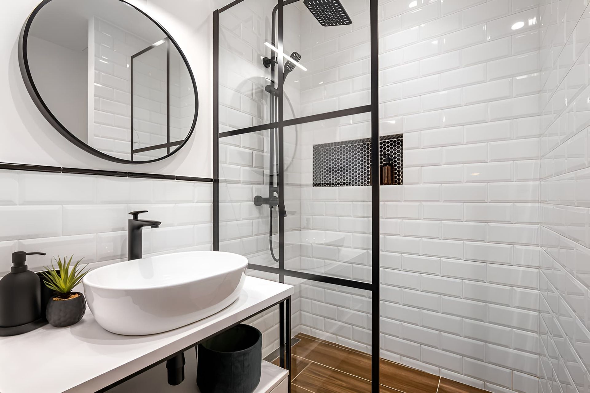 A Bathroom With A Sink , Mirror And Walk In Shower — McGrath Builders & Associates In Lavington, NSW