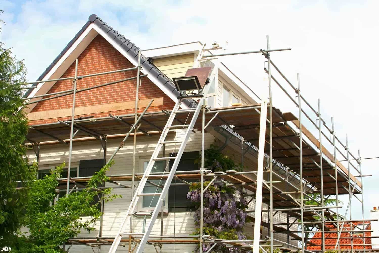 A House Is Being Remodeled With Scaffolding And A Ladder — McGrath Builders & Associates In Lavington, NSW