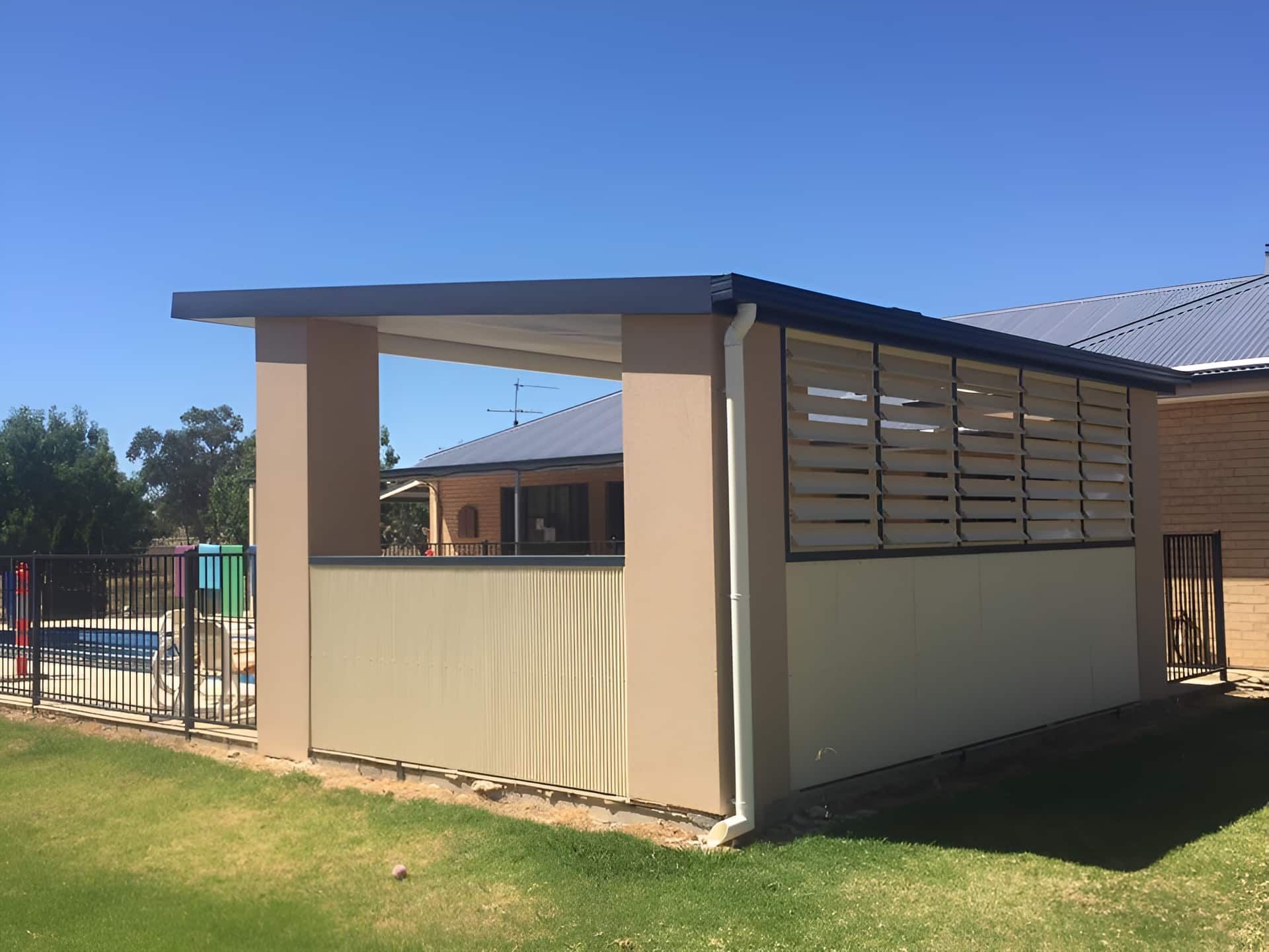 A House With A Covered Porch And A Pool In The Background — McGrath Builders & Associates In Lavington, NSW
