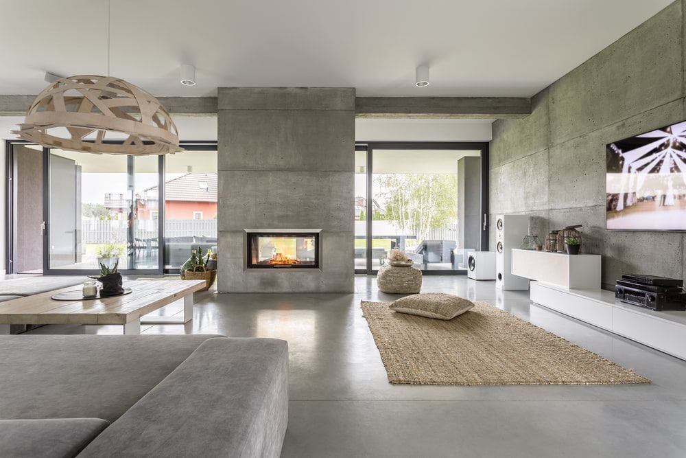 There Is A Fireplace In The Middle Of The Living Room — McGrath Builders & Associates In Lavington, NSW