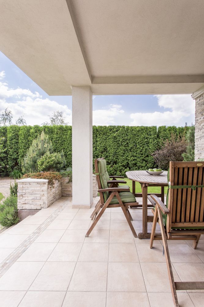 There Is A Patio With A Table And Chairs On It — McGrath Builders & Associates In Yarrawonga, VIC