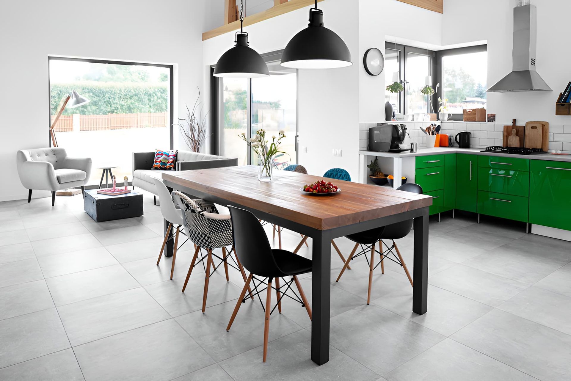 A Kitchen With A Dining Table And Chairs And Green Cabinets — McGrath Builders & Associates In Beechworth, VIC