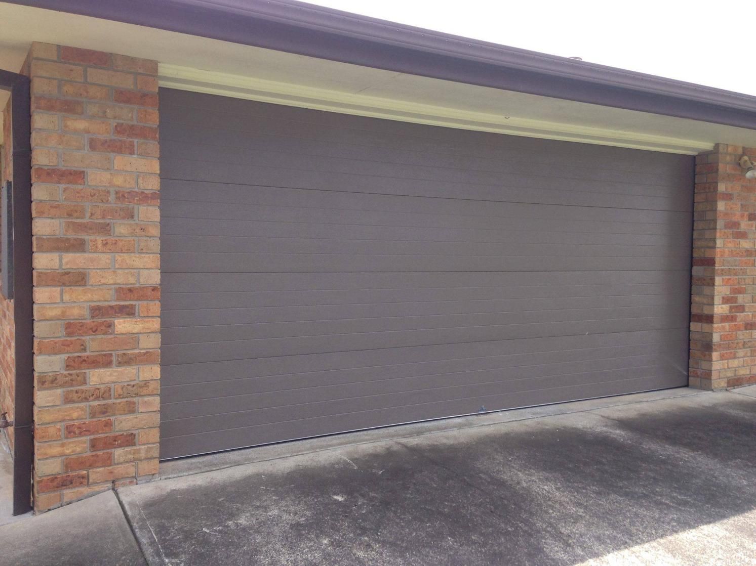 A House With a Garage Door — P & D Garage Doors in Taree, NSW
