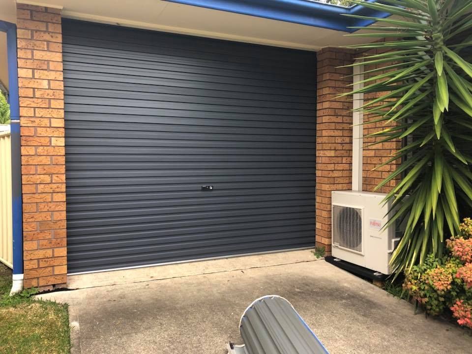 A Black Garage Door — P & D Garage Doors in Forster, NSW