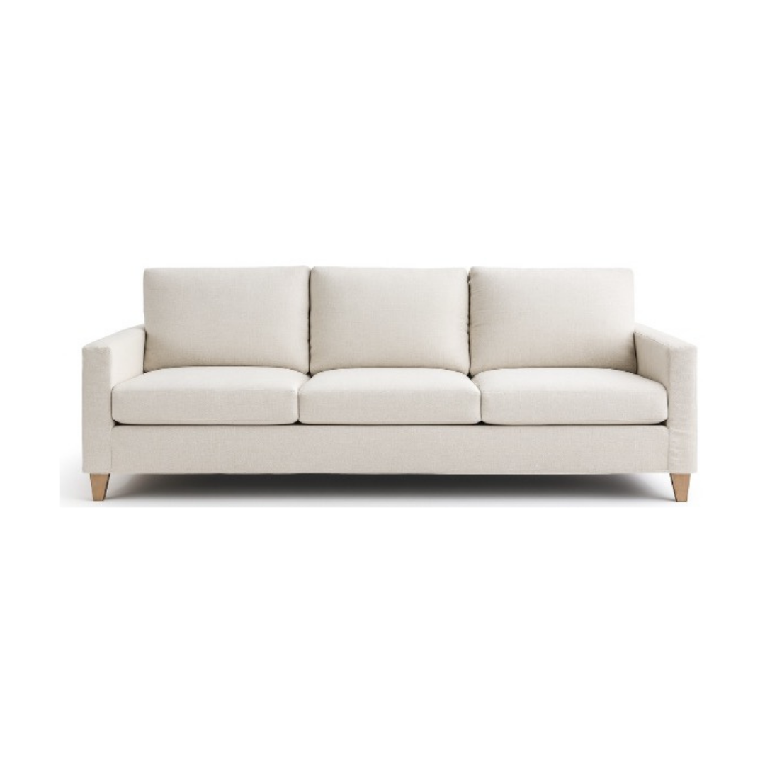 Cream-colored three-cushion sofa with a low profile and wooden legs against a white background.