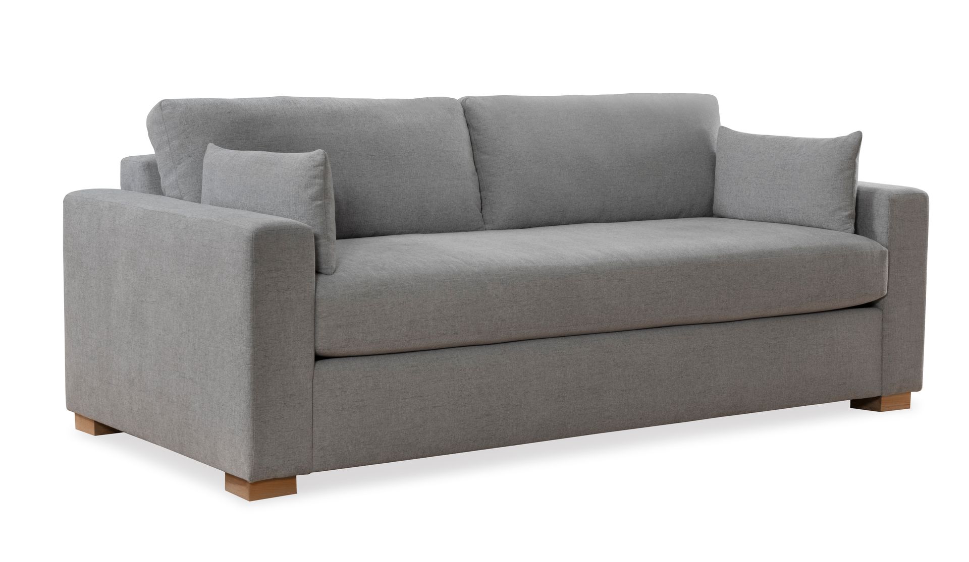 A grey couch with two pillows on it on a white background.