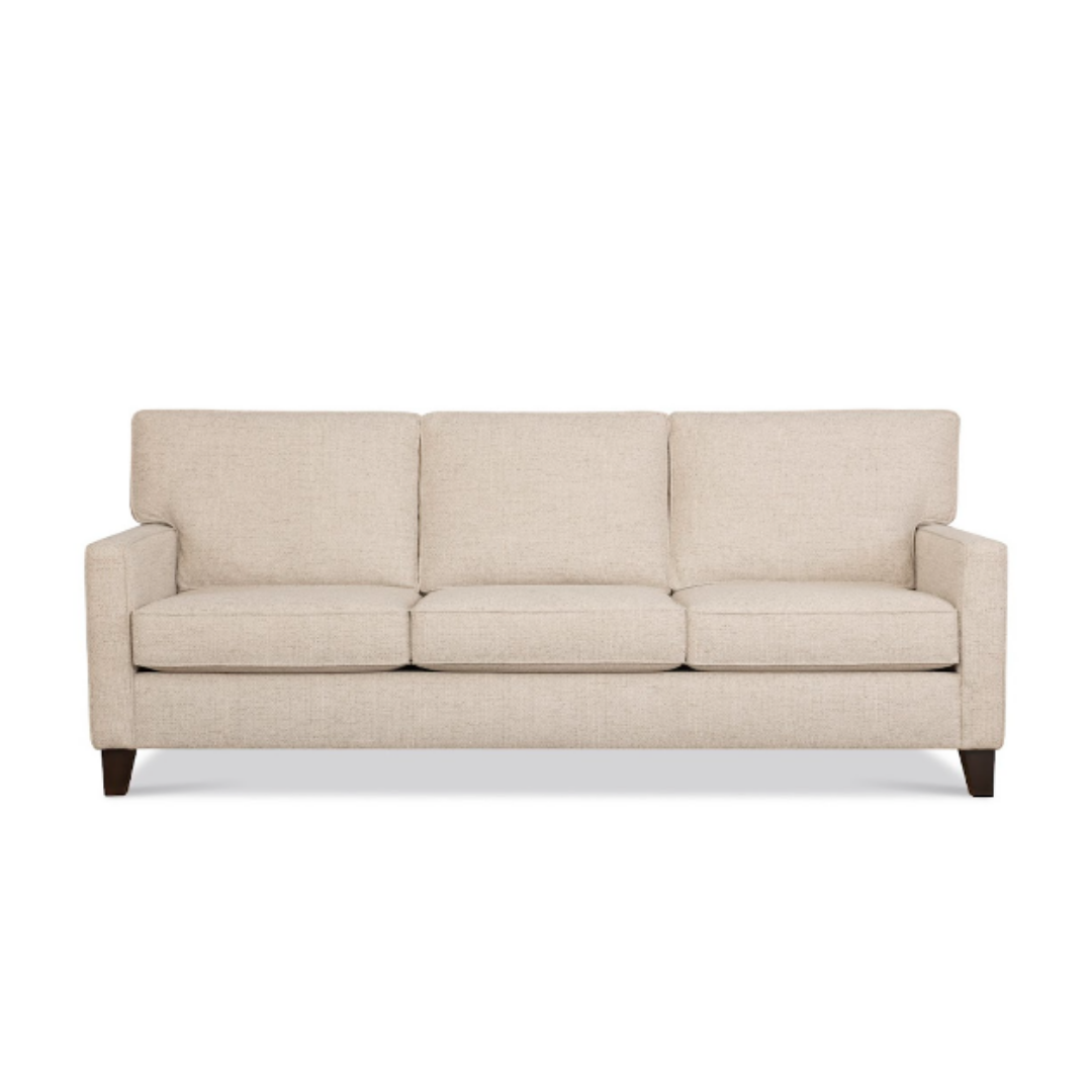 Beige three-cushion sofa with square arms and dark wooden legs.