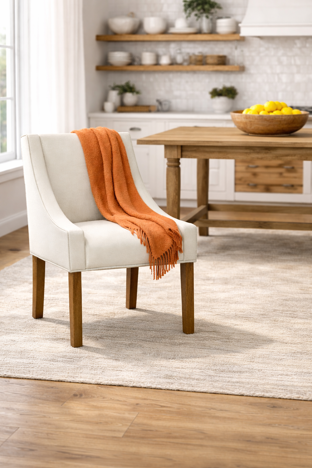 A living room with a large modern sectional couch and a rug.