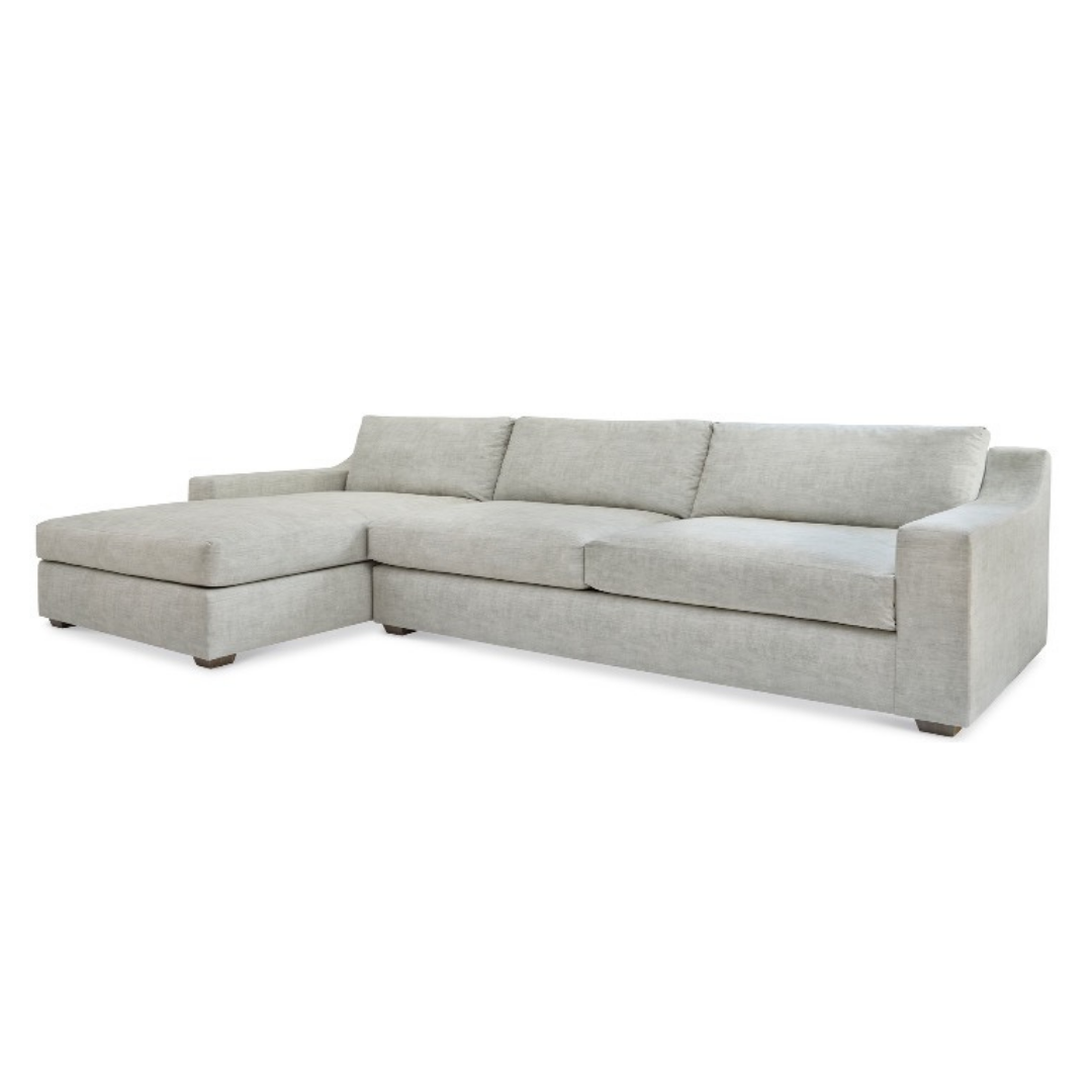 Light grey sectional sofa with a chaise lounge on the left side.