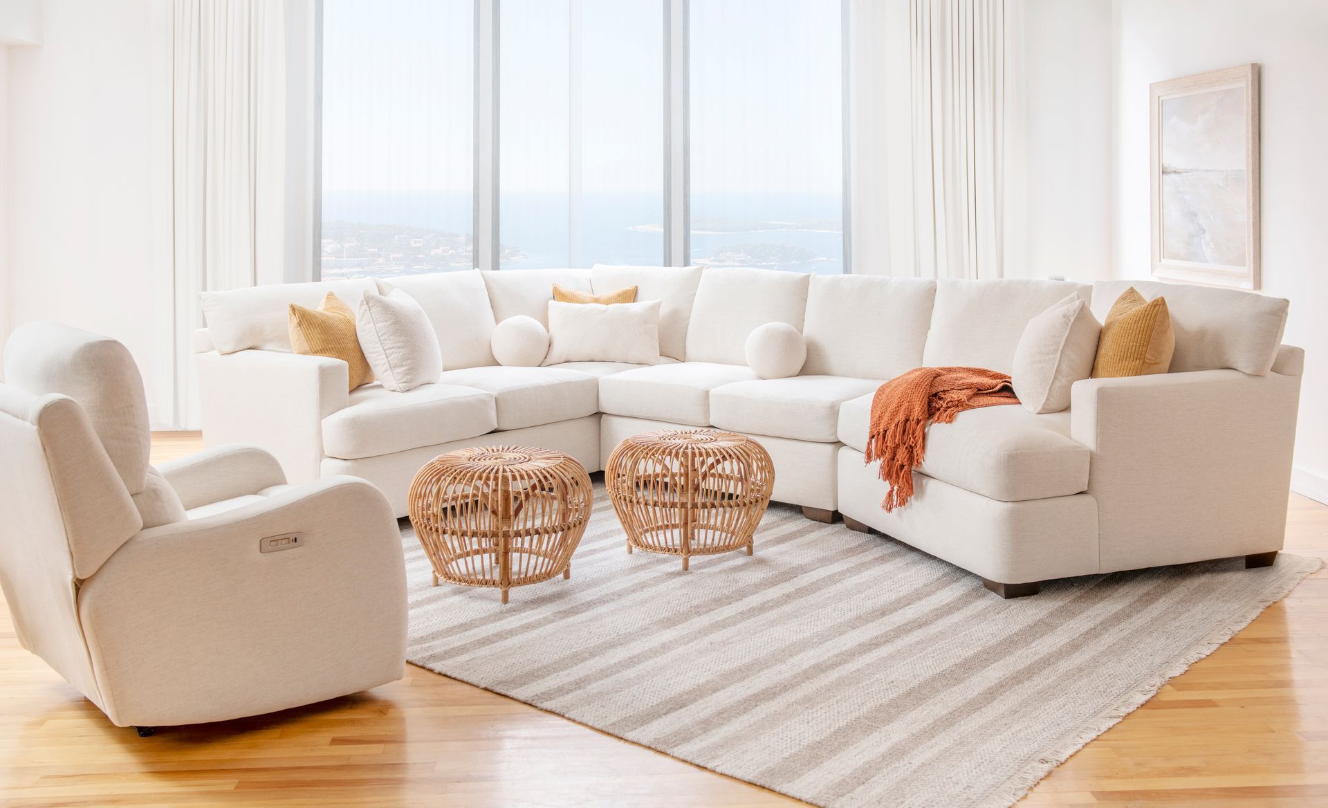 A living room filled with furniture and a large modern sectional couch.