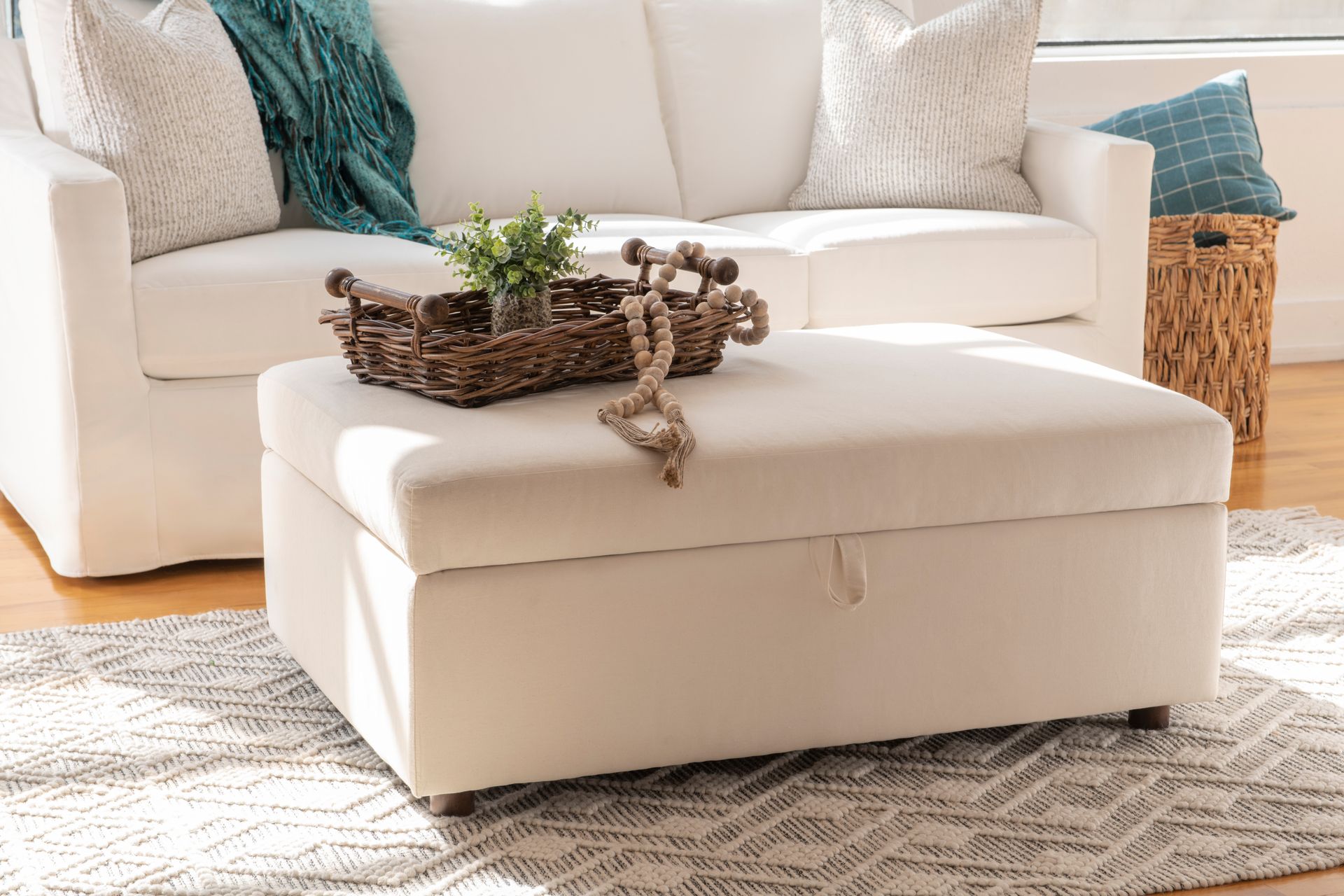 specialty sleeper ottoman with coffee table tray in light and airy living space