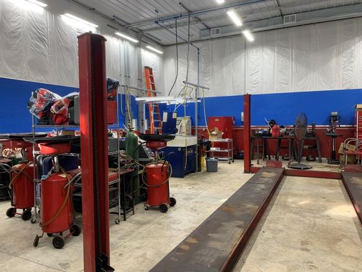 A mechanic 's shop with a lot of tools and equipment.