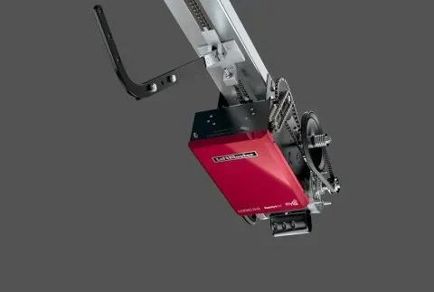 Red and black garage door opener with a chain track.