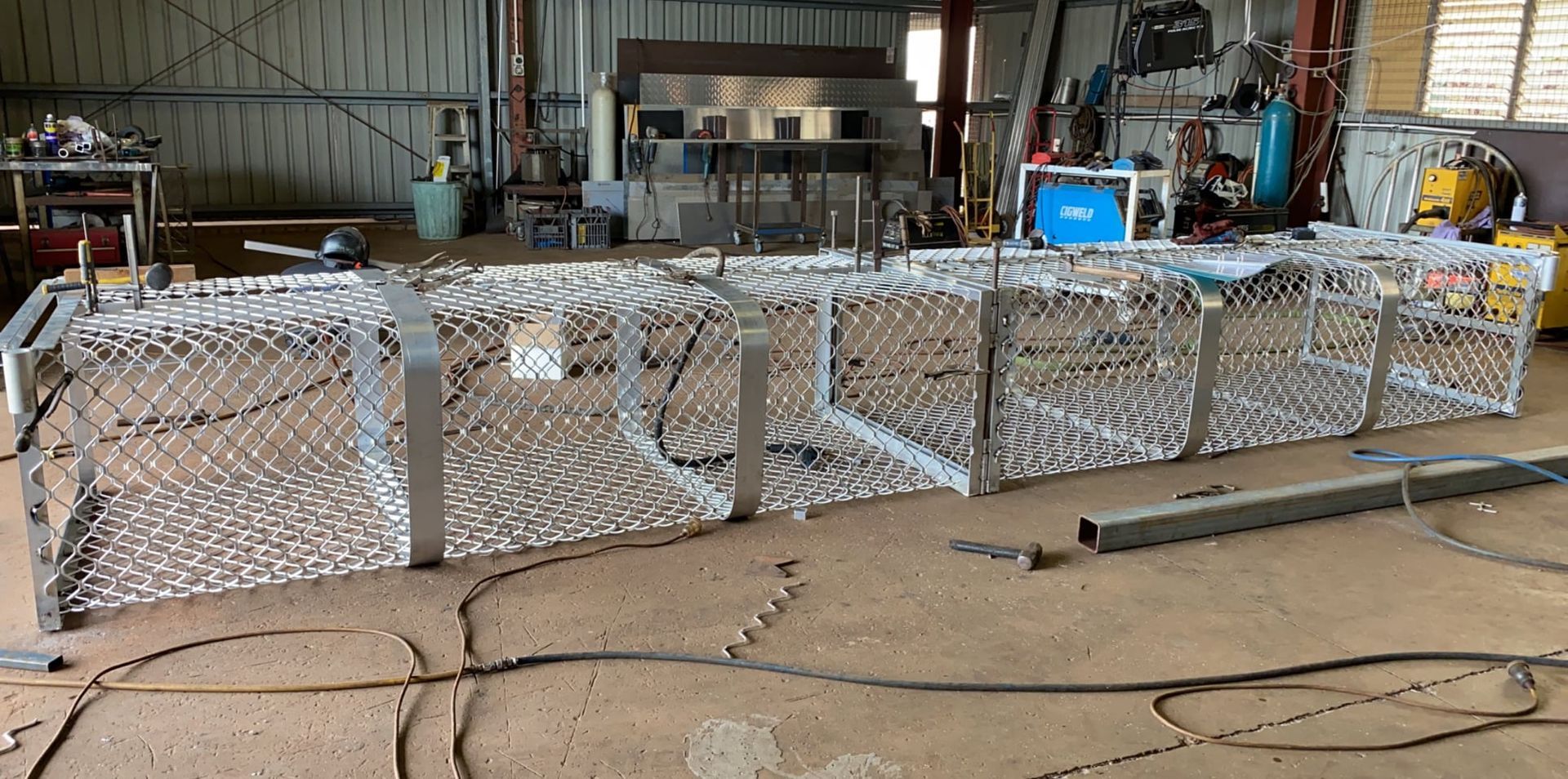 Metal Cage in a Workshop Setting, Possibly for Construction or Industrial Use — Greville Fabrication in Girraween, NSW