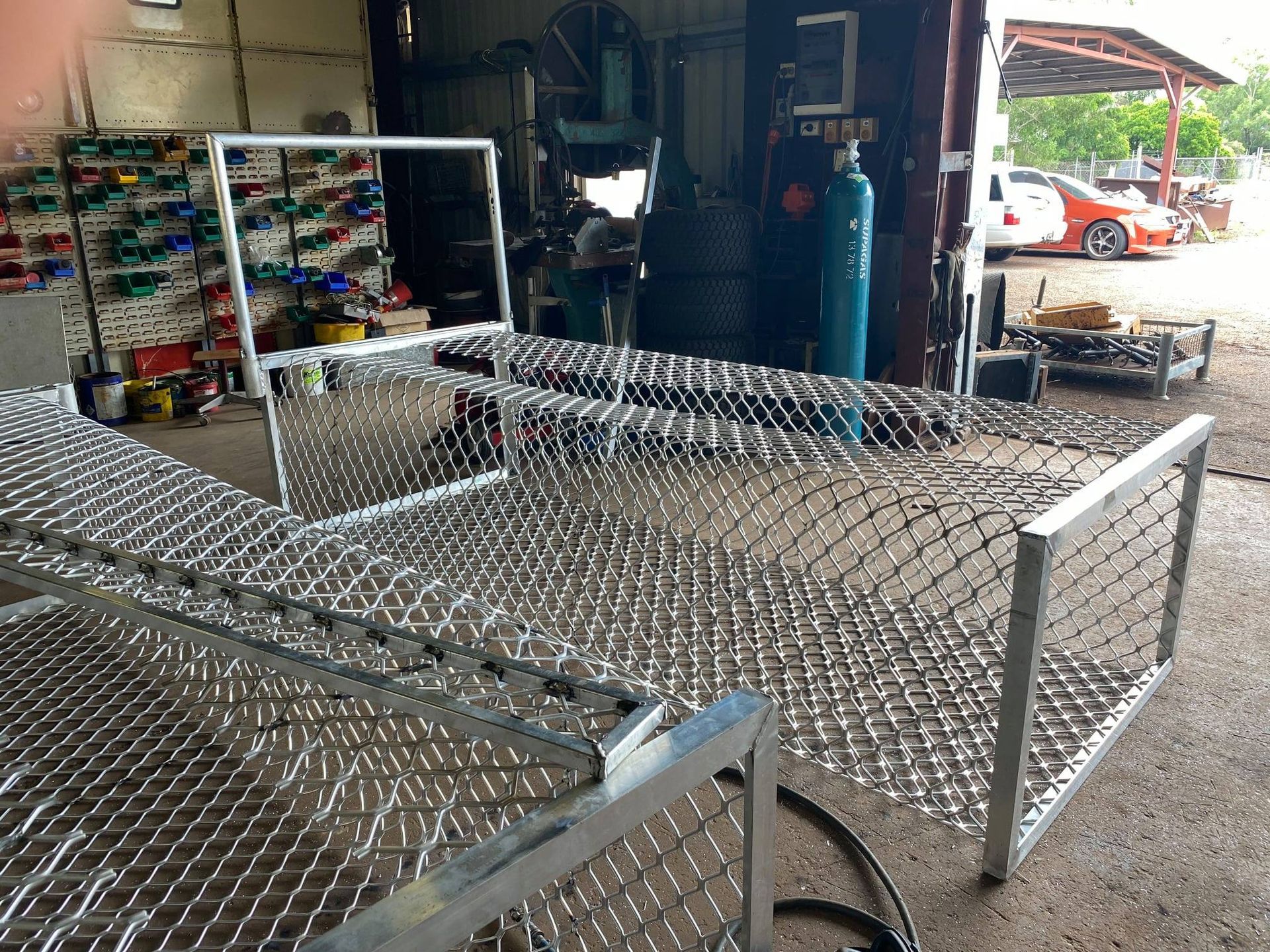 Chain-link Metal Cart Frame in a Workshop, With Shelves and Gas Cylinders — Greville Fabrication in Girraween, NSW