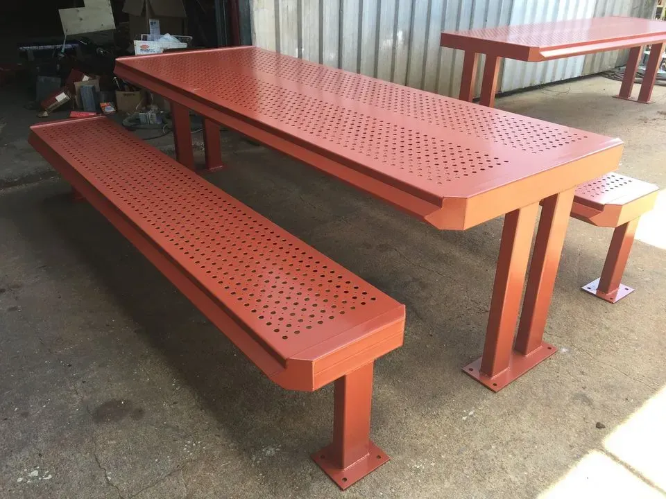 Red Perforated Metal Picnic Table With Attached Benches in a Workshop or Garage — Greville Fabrication in Girraween, NSW