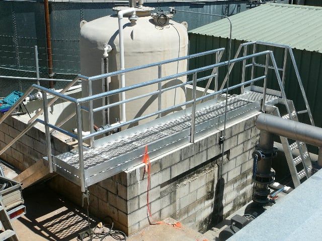 Industrial Equipment and Metal Catwalks Atop a Concrete Structure Outdoors — Greville Fabrication in Girraween, NSW